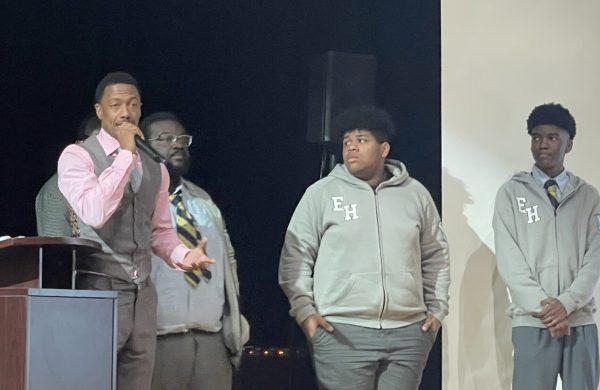 Left to right: Nick Cannon with Team reMind Me of Eagle Academy for Young Men of Harlem: Robert Loveless, Makail Williams, and Fritz Andral.